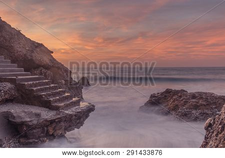 Nerja, Malaga, Andalusi, Spain - February 10, 2019: Ruin Of A Staircase On The Rocks Of The Coast In