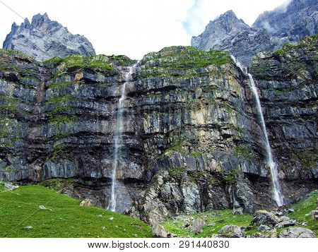 Nameless Waterfalls Under The Alpine Peaks Glarner Vorab And Bünder Vorab In The Valley Of Im Loch -