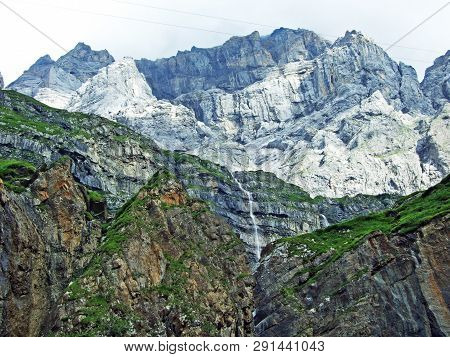 Nameless Waterfalls Under The Alpine Peaks Glarner Vorab And Bünder Vorab In The Valley Of Im Loch -