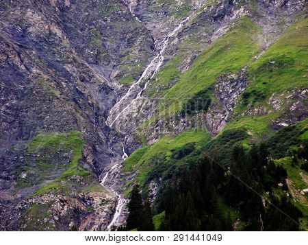 Nameless Waterfalls Under The Alpine Peaks Glarner Vorab And Bünder Vorab In The Valley Of Im Loch -