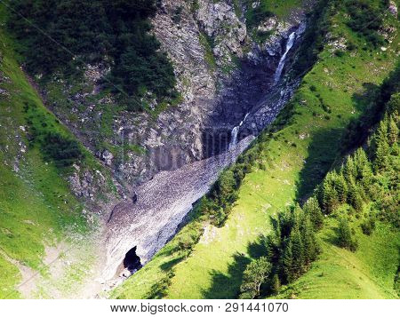 Nameless Waterfalls Under The Alpine Peaks Glarner Vorab And Bünder Vorab In The Valley Of Im Loch -