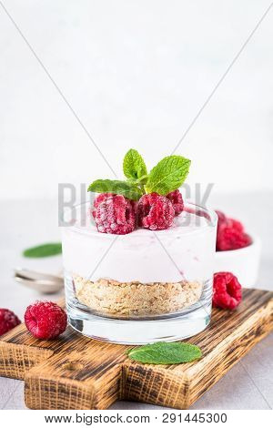 No Baked Cheesecake With Raspberry In Glass Jar. Healthy Dessert.