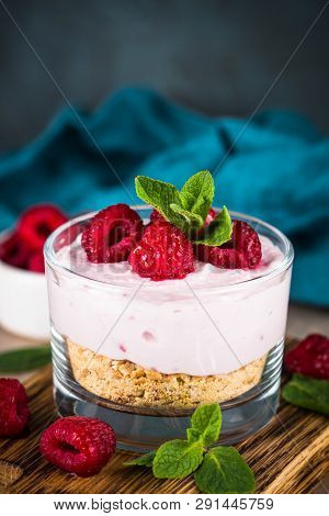 No Baked Cheesecake With Raspberry In Glass Jar. Healthy Dessert.