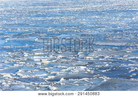 Spring Ice Drifting On The River On A Sunny Day. Background Texture