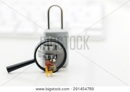 Miniature People Are Decrypting Unlock Padlock, Decrypt The Key. Concept For Data Security Breach, R