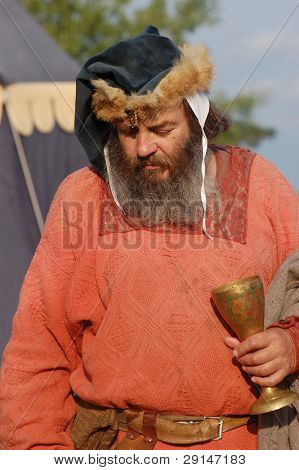 KIEV, UKRAINE - JULY 31: Member of history club Golden Capricorn wears medieval costume as he participates in historical festival and camp in memory of King Vladimir July 31, 2009 in Kiev, Ukraine.
