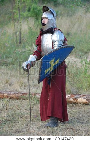 KIEV, UKRAINE - JULY 31: Member of history club Golden Capricorn wears medieval costume as he participates in historical festival and camp in memory of King Vladimir July 31, 2009 in Kiev, Ukraine.