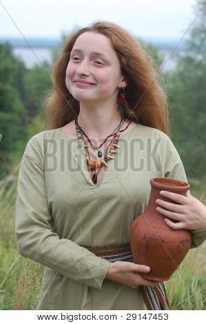KIEV, UKRAINE - JULY 31: Member of history club Golden Capricorn wears medieval costume as she participates in historical festival in memory of King Vladimir July 31, 2009 in Kiev, Ukraine.