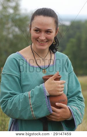 KIEV, UKRAINE - JULY 31: Member of history club Golden Capricorn wears medieval costume as she participates in historical festival in memory of King Vladimir July 31, 2009 in Kiev, Ukraine.