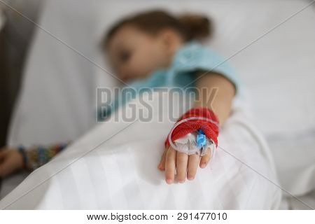 Details With A Cannula On The Hand Of A Ill Little Girl In A Pediatric Hospital Reserve