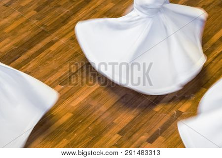 Unidentified whirling Dervishes or Semazen in Konya, Turkey