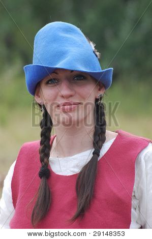 KIEV, UKRAINE - JULY 31: Member of history club Golden Capricorn wears medieval costume as she participates in historical festival in memory of King Vladimir July 31, 2009 in Kiev, Ukraine.