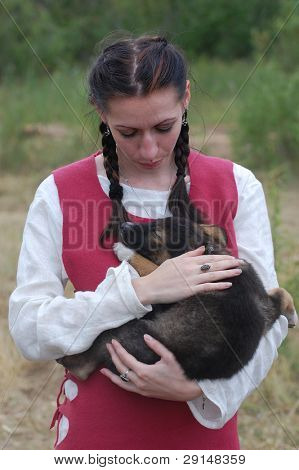  KIEV, UKRAINE - JULY 31: Member of history club Golden Capricorn wears medieval costume as she participates in historical festival in memory of King Vladimir July 31, 2009 in Kiev, Ukraine.