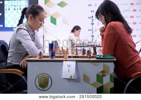 ST. PETERSBURG, RUSSIA - DECEMBER 28, 2018: Match World Champion Ju Wenjun, China (rightt) vs Zhansaya Abdumalik, Kazakhstan during World Rapid Chess Championship 2018. The match ended in a draw