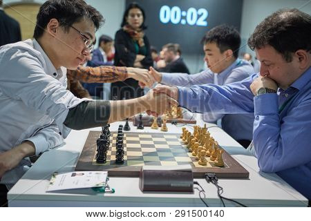 ST. PETERSBURG, RUSSIA - DECEMBER 30, 2018: Handshake before the match in King Salman World Blitz Chess Championship 2018. 204 athletes take part in the tournament