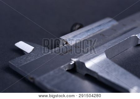 Vintage Steel Caliper Tool Closeup. Scale In Focus. Tool In Very Good Condition. Scale In Metric Uni