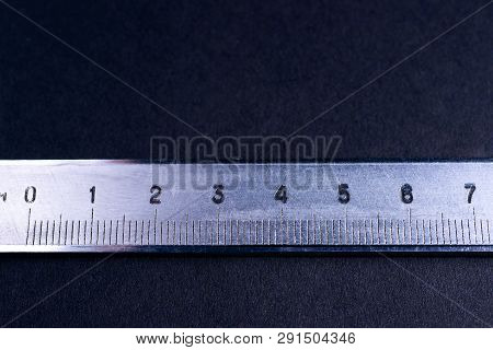 Vintage Steel Caliper Metric Scale On Dark Background. Scale In Focus. Tools In Very Good Condition.