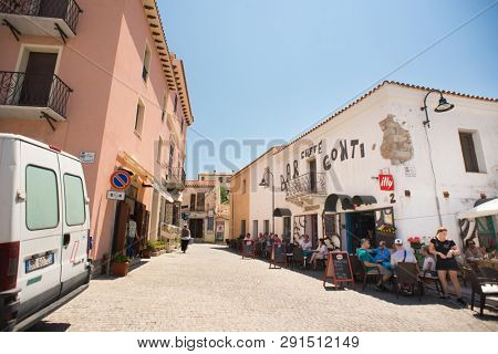 Santa Teresa Gallura, Sardinia, Italy - July 9, 2018: Street Shop and Cafe with Tourists in Santa Teresa Gallura City, Sardinia, Italy.