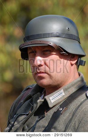 KIEV, UKRAINE - SEPT 19, : Member of a history club wear historical German uniforms as he participates in a WWII reenactment.Buttle for Kiev in 1943. September 19 , 2009 in Kiev, Ukraine