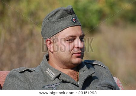 KIEV, UKRAINE - SEPT 19, : Member of a history club wear historical German uniforms as he participates in a WWII reenactment.Buttle for Kiev in 1943. September 19 , 2009 in Kiev, Ukraine