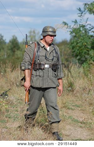 KIEV, UKRAINE - SEPT 19, : Member of a history club wear historical German uniforms as he participates in a WWII reenactment.Buttle for Kiev in 1943. September 19 , 2009 in Kiev, Ukraine