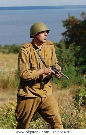 KIEV, UKRAINE - SEPT 19, : Member of a history club wear historical Soviet  uniforms as he participates in a WWII reenactment.Buttle for Kiev in 1943. September 19 , 2009 in Kiev, Ukraine