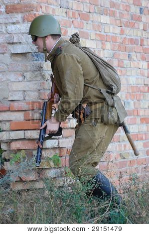 KIEV, UKRAINE - SEPT 19, : Member of a history club wear historical Soviet  uniforms as he participates in a WWII reenactment.Buttle for Kiev in 1943. September 19 , 2009 in Kiev, Ukraine