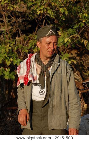 KIEV, UKRAINE - SEPT 19, : Member of a history club wear historical German uniforms as he participates in a WWII reenactment.Buttle for Kiev in 1943. September 19 , 2009 in Kiev, Ukraine