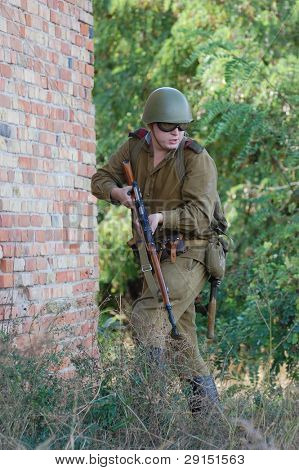 KIEV, UKRAINE - SEPT 19, : Member of a history club wear historical Soviet  uniforms as he participates in a WWII reenactment.Buttle for Kiev in 1943. September 19 , 2009 in Kiev, Ukraine