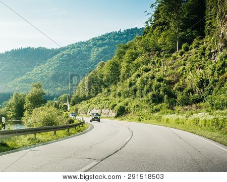 Schiltach, Germany - Jun 10, 2018: German Highway With Suzuki Suv Suv Car Driving Fast On The Rural 