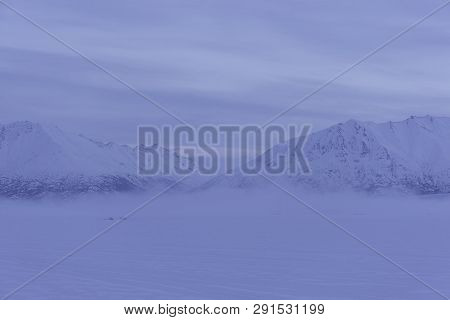 Morning Fog At Alaskan Lake In Winter