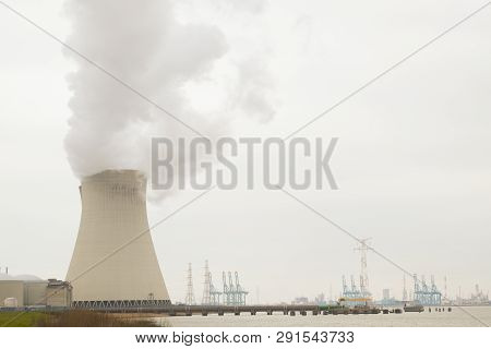 May 2016, Doel, Antwerp, Belgium, Cooling Towers Of The Nucleair Power Plant In Doel Next To The Riv