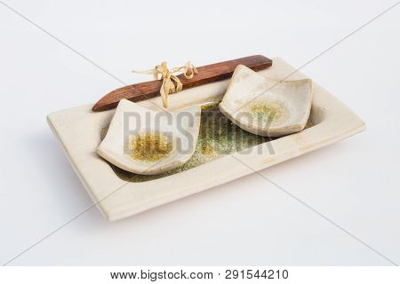 Two Ceramic Stoneware Wells And A Wooden Knife With White Background