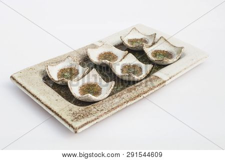 Six Ceramic Stoneware Wells With White Background