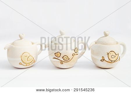 Three White Ceramic Teapots Stoneware With White Background