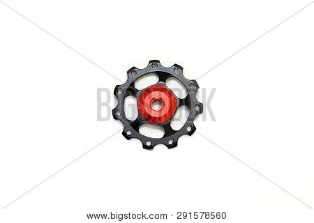 Black And Red Roller, Gear For Bicycle Rear Derailleur Isolated On White Background