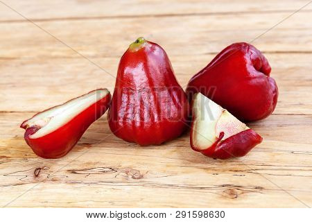 Ripe Rose Apples Or Chomphu Fruits On Wooden Table.