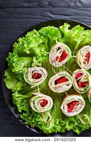 Sliced Sandwich Wrap Kebabs With Whole Grain Flatbread Layered With Ham, Cheese, Fresh Lettuce Leave