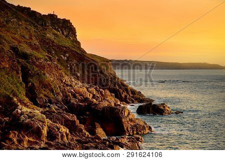 Rugged Cornish Coastline At Porth Nanven On Sunny Evening, Cornwall, England