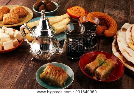 Middle Eastern Or Arabic Dishes And Assorted Meze, Concrete Rustic Background. Turkish Bread Or Turk