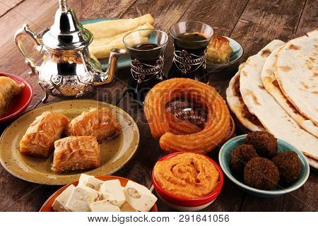 Middle Eastern Or Arabic Dishes And Assorted Meze, Concrete Rustic Background. Turkish Bread Or Turk