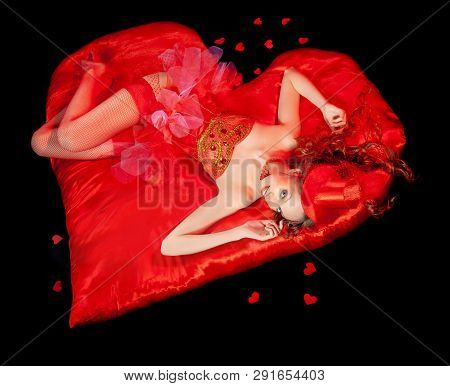 Sexy Burlesque Dancer Stripper Posing With Sweet Lollipop, In Red Corset And Red Hat With Curly Hair