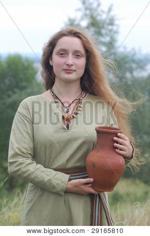 KIEV, UKRAINE - JULY 31: Member of history club Golden Capricorn wears medieval costume as she participates in historical festival in memory of King Vladimir July 31, 2009 in Kiev, Ukraine.