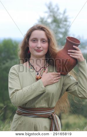 KIEV, UKRAINE - JULY 31: Member of history club Golden Capricorn wears medieval costume as she participates in historical festival in memory of King Vladimir July 31, 2009 in Kiev, Ukraine.