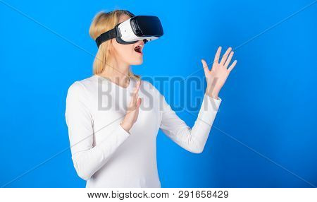 Cheerful Smiling Woman Looking In Vr Glasses. Confident Young Woman Adjusting Her Virtual Reality He