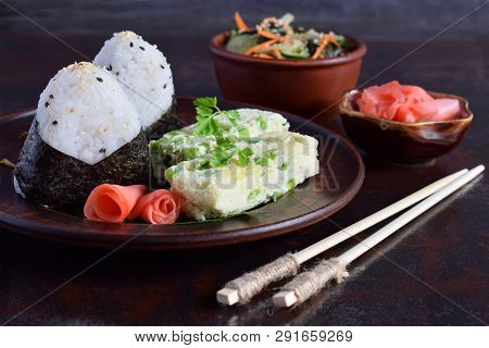 Mix Of Japanese Food - Rice Balls Onigiri, Omelette, Pickled Ginger, Sunomono Wakame Cucumber Salad