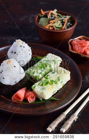 Mix Of Japanese Food - Rice Balls Onigiri, Omelette, Pickled Ginger, Sunomono Wakame Cucumber Salad