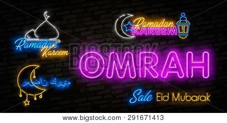 Neon Sign Ramadan Kareem With Lettering Omrah And Crescent Moon Against A Brick Wall Background. Ara