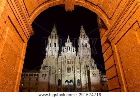 Cathedral At Night From Town Hall Arch, Palacio De Rajoy. Baroque Facade And Towers. Santiago De Com