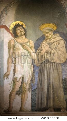 FLORENCE, ITALY - JANUARY 10, 2019: Saint John the Baptist and Saint Francis of Assisi, fresco by Domenico Veneziano, Basilica di Santa Croce (Basilica of the Holy Cross) in Florence, Italy